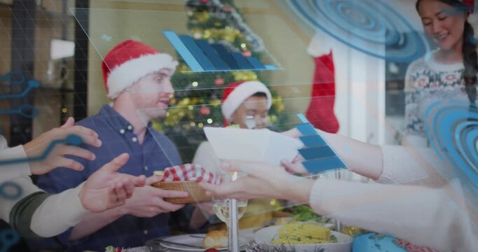 Animation of interface with data processing against family having dinner together during christmas