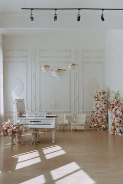 White Grand Piano in Elegant Sunlit Interior