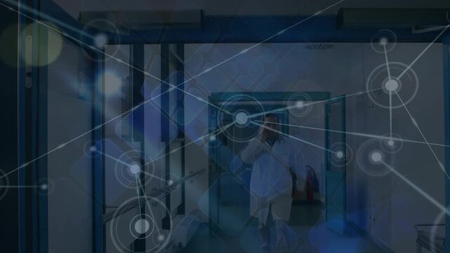 Animation of network of connections with icons over walking caucasian doctor