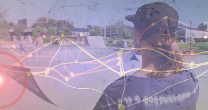 Male skater facing away from camera at outdoor skate park, showing technology network graph overlay