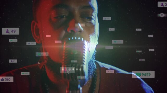 Male singer leaning into microphone, singing and activating multiplying counters for streaming