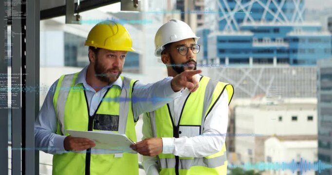 Construction team consulting plans, pointing after plan check, following HUD overlays, coordinating