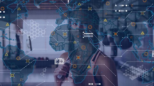 Vertical video: Woman holding rope in gym, map overlay rising over upper body, showing fitness data