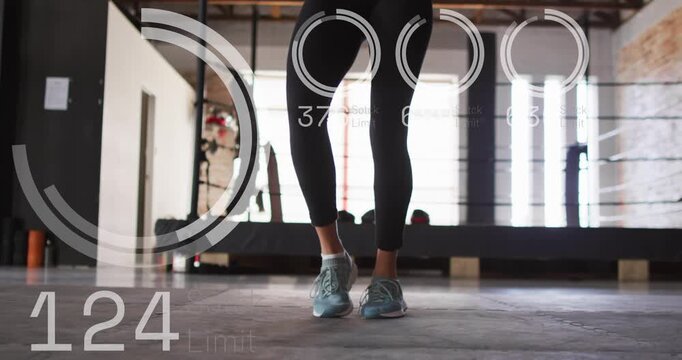 Woman doing hops in gym, overlay appearing counting reps for fitness, counter rising then falling