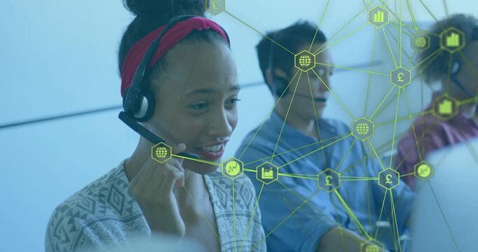 Support agent taking call, adjusting mic and reading screen as green network overlaying her screen