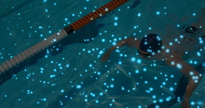 Vertical video: Swimmer initiating strokes through lane, blue dots overlay hiding view for fitness