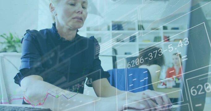 Woman typing on laptop in open-plan office, initiating HUD overlays and analyzing finance charts