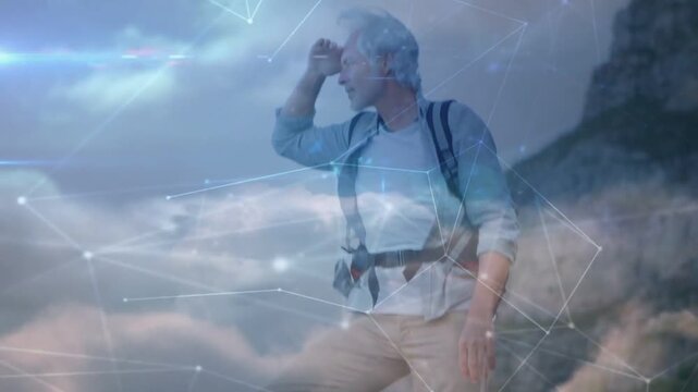 Vertical video: Hiker planting foot on ledge starting tech net and clouds rising as surveying route