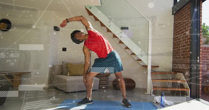 Adult male following overlay prompt, performing left side-stretch on blue mat, guiding fitness form