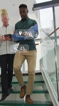 Starting down coworkers green-shirt checking blue folder tablet on glass stairs with icons for prep