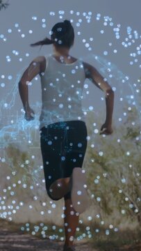 Vertical video: Runner entering right running dirt trail with holo nodes cam tracking low training