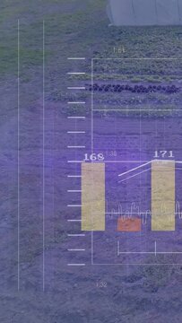Vertical video: HUD over farm, data driving bars rising, line peaking for crop tracking as view pan