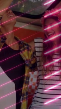 Vertical video: Phone tap starting crew fixing crown and hat, leaning and posing for neon selfie