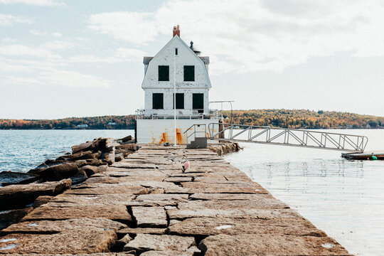 Rockland Breakwater Lighthouse at end of long stone pier