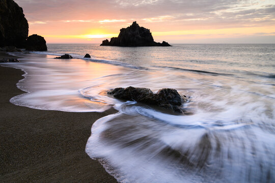 Sunset light waves and sea stack at the beach, Aichi, Japan