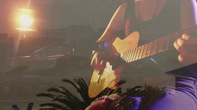 Overlay fading from right causing teen player becoming clear while strumming over sunset for music