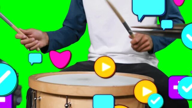 Vertical video: Seated drummer switching hits as icons entering frame, showing engagement