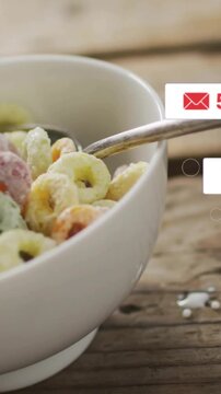 Vertical video: Bowl settling, badges appearing, cursor clicking, milk pouring, showing social buzz