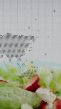 Vertical video: Camera shifting, salad rising, highlighting food while dotted APAC map overlaying