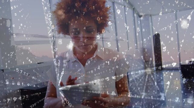 An executive using a digital tablet in an office setting, with binary code running in the background