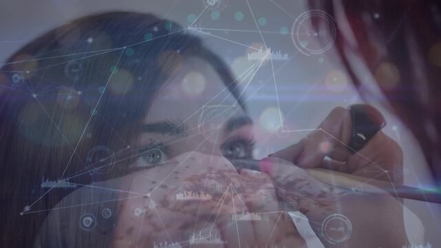 Animation of financial data processing over women doing makeup