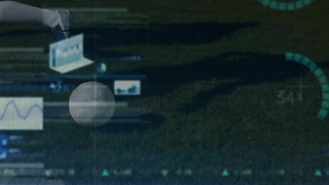 A football player is controlling the ball on a pitch in slow motion