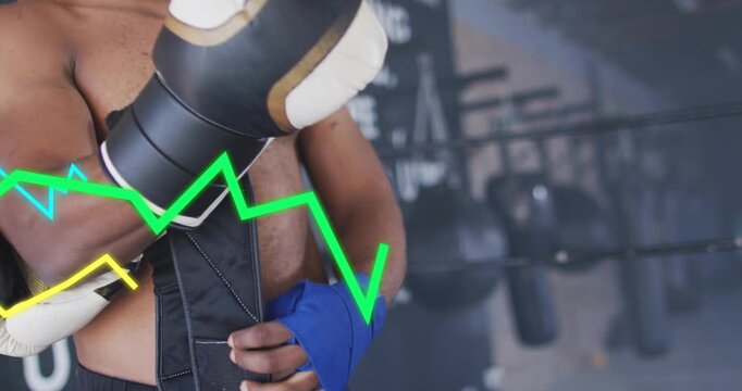 Male boxer wrapping blue wrap and fastening glove, activating animated lines during training prep