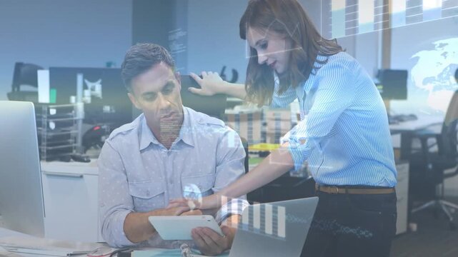 Woman leaning over tablet, guiding man tapping and comparing monitor with business graphs appearing