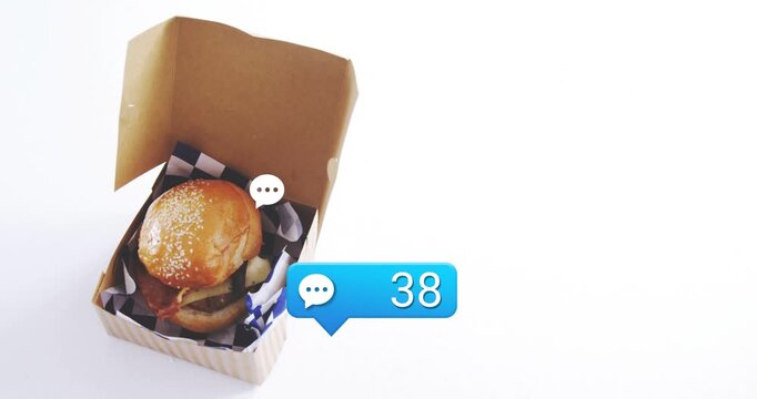 Frames advancing, food box with burger attracting comment bubble updating to 95, boosting reach