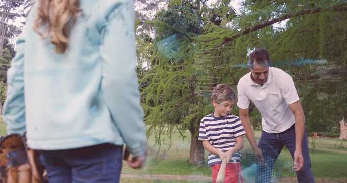 Vertical video: Girl tossing baseball, father guiding son swinging wooden bat for sports coaching
