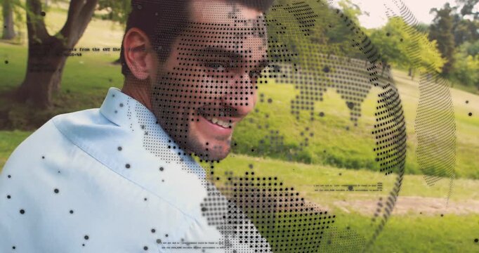 Mid-adult man turning to camera in park while dotted globe overlay shifting, causing smile for tech