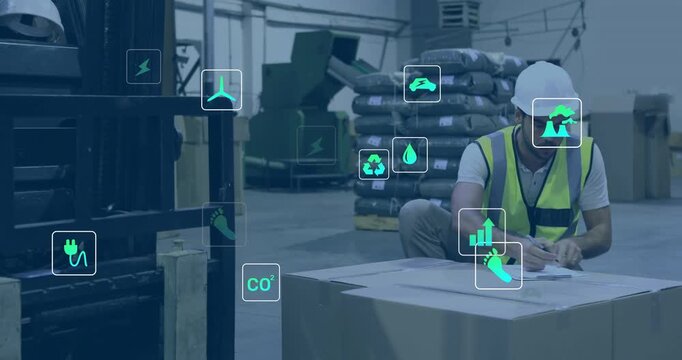 Vertical video: Warehouse worker using clipboard checking box logging energy labels icons over box