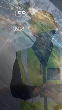 Vertical video: Site inspector turning and tapping tablet, updating globe readouts for inspection