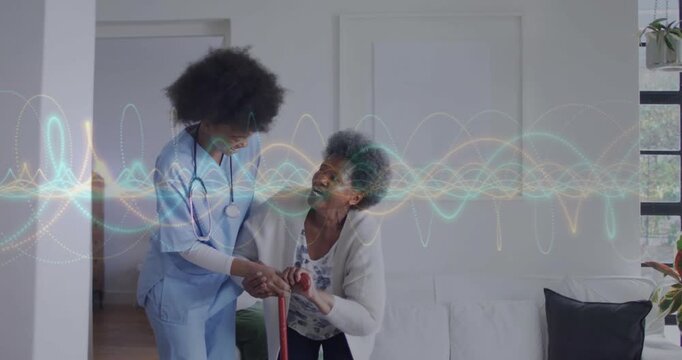 Vertical video: Nurse gripping red cane, helping senior stand for safety with health waveform