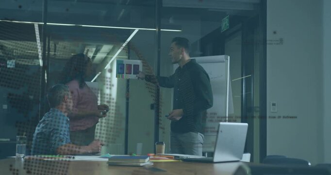 Presenter pointing swatches, woman approaching, animated notes on flipchart marking design decision