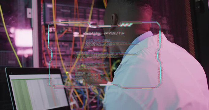 Male IT tech noticing laptop log update and adjusting patch cables while HUD overlay flickering
