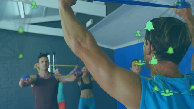 Vertical video: Coach leading band pull in gym, class syncing blue bands, green icons over coach