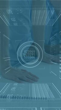 Vertical video: HUD appearing guiding office hands writing, pausing, reviewing data on notebook