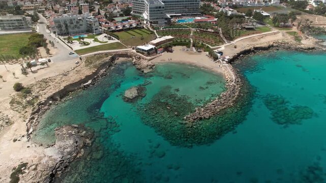 Aerial view of the turquoise sea and coastline of kalamies beach in paralimni, cyprus