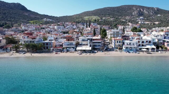 Aerial view of the coastal town of tolo in argolida, peloponnese, with turquoise sea and sandy beach