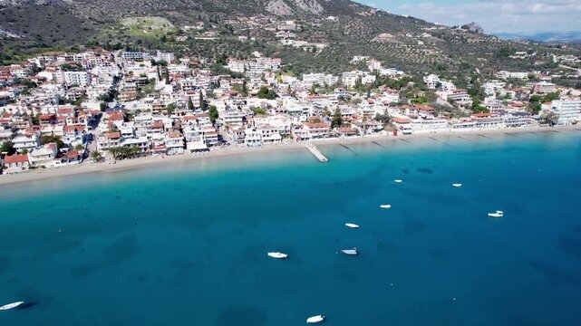 Scenic aerial footage of the seaside town of tolo in peloponnese, greece