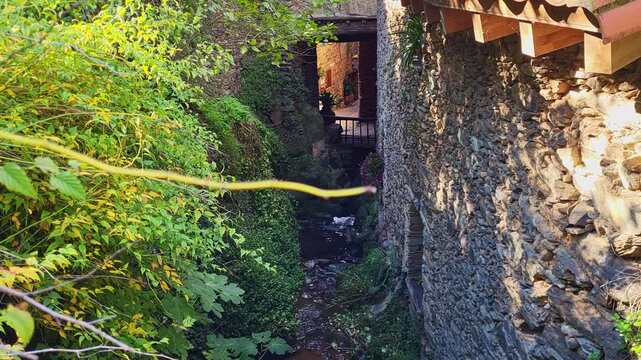 The springs of Robledillo de Gata. Water springs that run through the streets of an old village built with stone and slate. A famous and charming Spanish village.