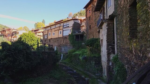 Robledillo de Gata. C&aacute;ceres. Spain. Panoramic view. Beautiful mountain village with stone and slate buildings. Waterfall next to picturesque stone and slate houses.