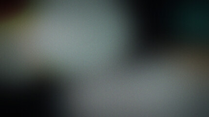Obraz premium Abstract blurred background, with heavy grain, texture, featuring soft, transitions of muted, grey, dark blue, and subtle warm, brown tones