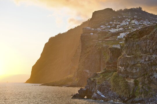 View along the coast to the cliffs of Cabo Girao, Camara de Lobos, Madeira, Portugal