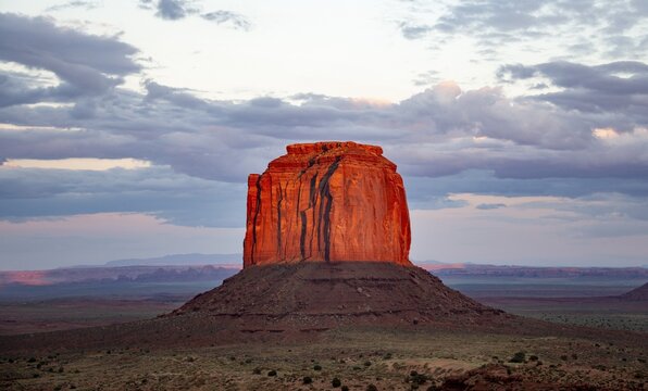 Table Mountain glows red at sunset, Merrick Butte, Navajo Tribal Park, Navajo Nation Reservation, Arizona, Utah, USA