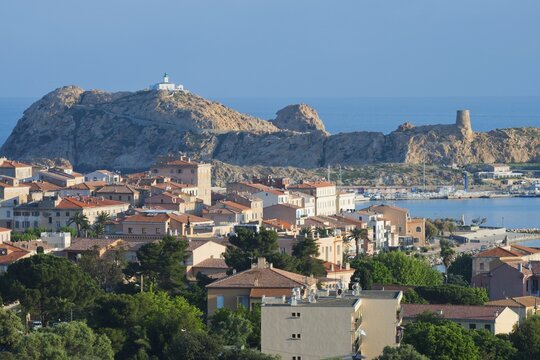 Port city with lighthouse, L'&Icirc;le-Rousse, Corsica, France