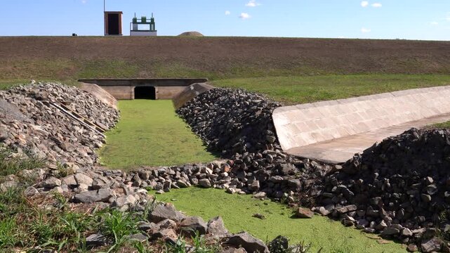 Water flowing from culvert outlet, system for irrigation, managing resources