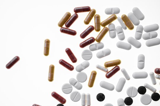 Colourful tablets, capsules, pills and drag&eacute;es, against a white background, Germany