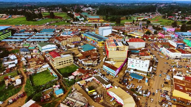 Aerial flyover poor Kitale Slum and modern skyline of Kitale rural urban area of kenya during sunny day. Two class society in Africa.